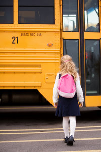 girl walking to bus